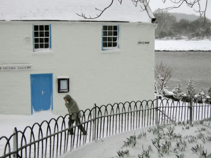 Framed Print : Man walks past the Harbour Cottage Gallery in Kirkcudbright Framed Print : Man walks past the Harbour Cottage Gallery in Kirkcudbright