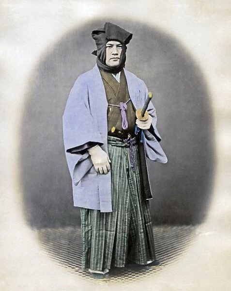 Man in winter dress with sword, Japan, circa 1870s