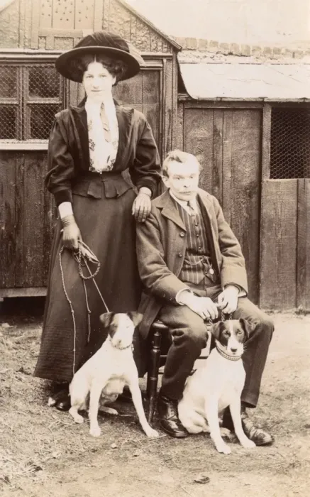 Framed Print : Man and woman with two Jack Russell terriers Framed Print : Man and woman with two Jack Russell terriers
