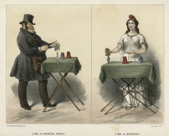 Framed Print : Man and woman magicians performing tricks at table Framed Print : Man and woman magicians performing tricks at table