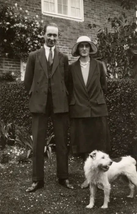 Framed Print : Man and woman with a terrier dog in a garden Framed Print : Man and woman with a terrier dog in a garden