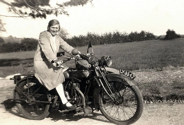 Man & woman on veteran motorcycle combination