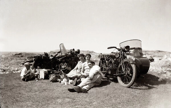 Man with women beside their 1924 Coventry Eagle motorcycles