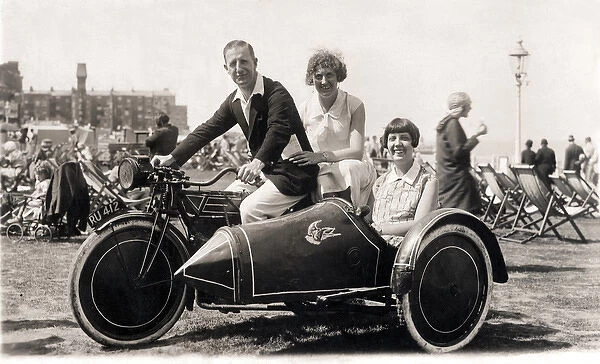 Man & two women on veteran motorcycle combination