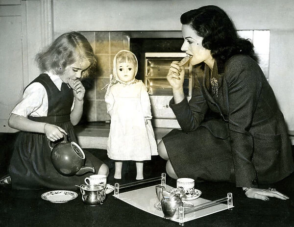 Margaret Lockwood at tea party with daughter Julia