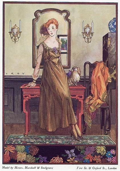 Marshall & Snelgrove gown: loose fitting, high waisted ankle length gown in a bronze fabric, round neckline, Medici style collar, translucent sleeves & reverse cuffs. Date: 1915