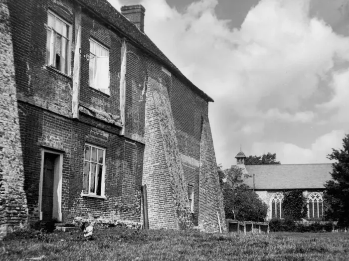 Framed Print : These massive buttresses now adjoining a house, were once part of Wix Abbey, Essex Framed Print : These massive buttresses now adjoining a house, were once part of Wix Abbey, Essex