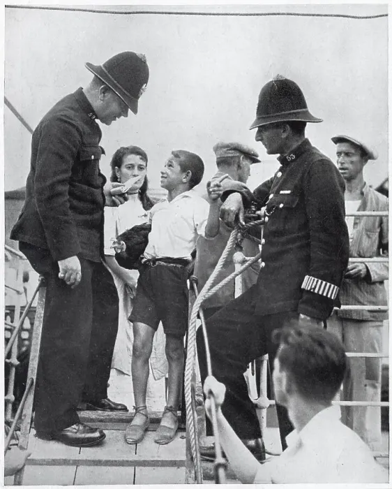 Framed Print : Two members of Gibraltar's police force questioning a Spanish boy on the gang-way of a refugee boat, August 1936. The Spanish Civil War, which started in the summer of 1936, meant that thousands of Spaniards became refugees Framed Print : Two members of Gibraltar's police force questioning a Spanish boy on the gang-way of a refugee boat, August 1936. The Spanish Civil War, which started in the summer of 1936, meant that thousands of Spaniards became refugees