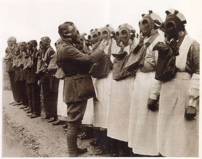 Framed Print : Members of the Red Cross nurses of the Camberwell division learning how to use gas masks, under expert supervision of a Territorial Officer. Date: December 1933 Framed Print : Members of the Red Cross nurses of the Camberwell division learning how to use gas masks, under expert supervision of a Territorial Officer. Date: December 1933