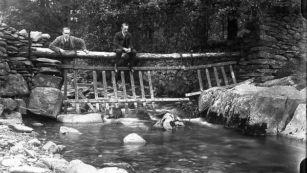 Two men on a bridge at Tilberthwaite in the Lake District