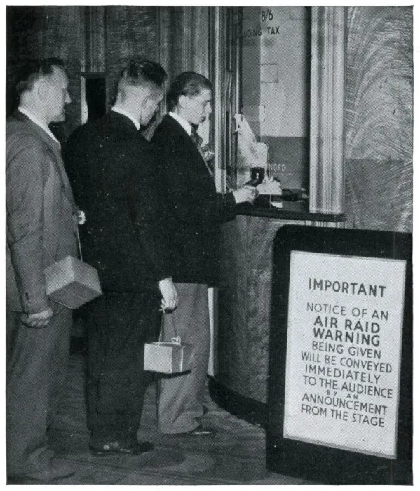 Framed Print : Three men at the cinema with their gas masks, September 1939 Framed Print : Three men at the cinema with their gas masks, September 1939