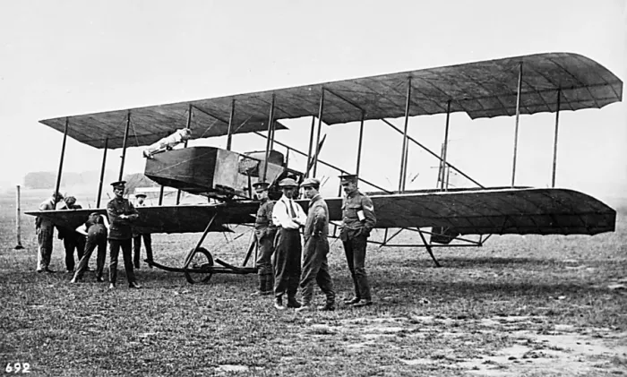 Framed Print : Men in a field with an early biplane Framed Print : Men in a field with an early biplane
