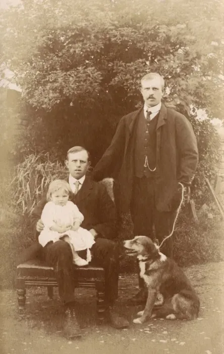 Framed Print : Two men, a little girl and a dog in a garden Framed Print : Two men, a little girl and a dog in a garden