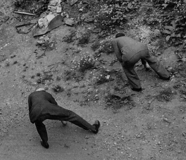 Men looking for shrapnel, 1940