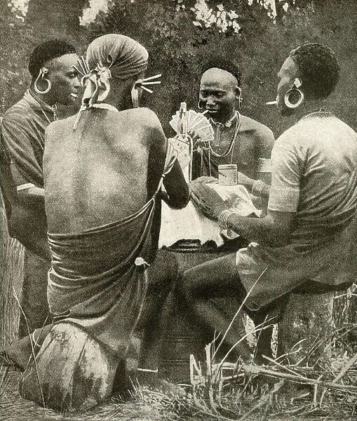 Four men playing cards, Kenya, East Africa
