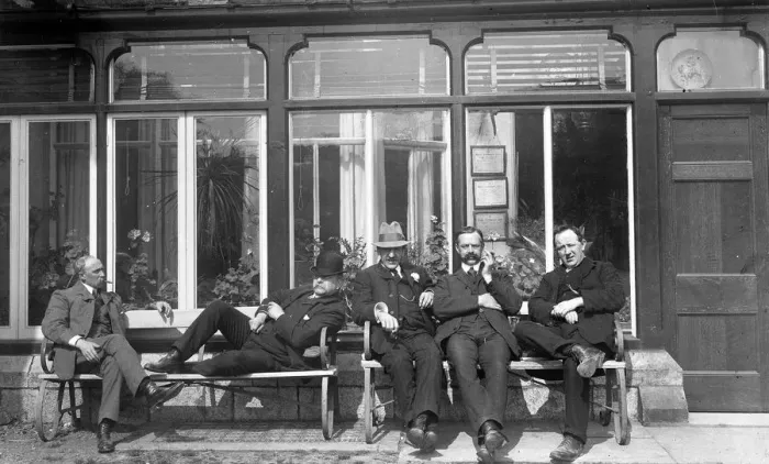 Framed Print : Five men relaxing on a bench Framed Print : Five men relaxing on a bench