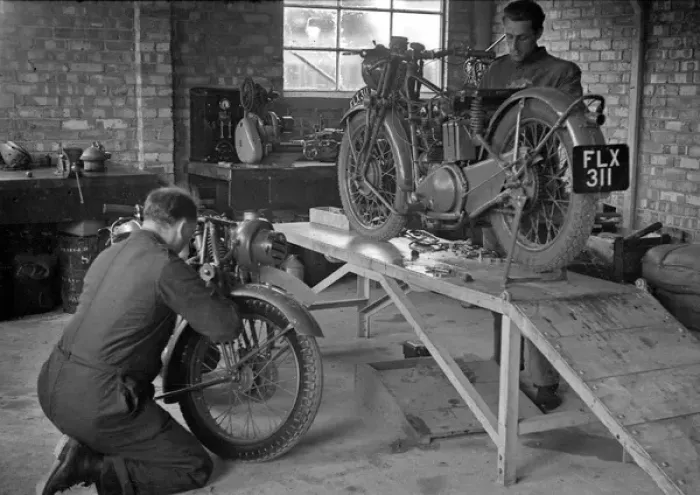 Framed Print : Two men repairing motorcycles Framed Print : Two men repairing motorcycles