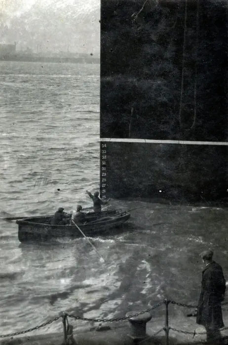 Framed Print : Three men in a rowing boat dwarfed next to prow of a steamer Framed Print : Three men in a rowing boat dwarfed next to prow of a steamer