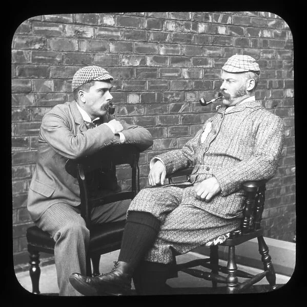 Two men sitting smoking their pipes