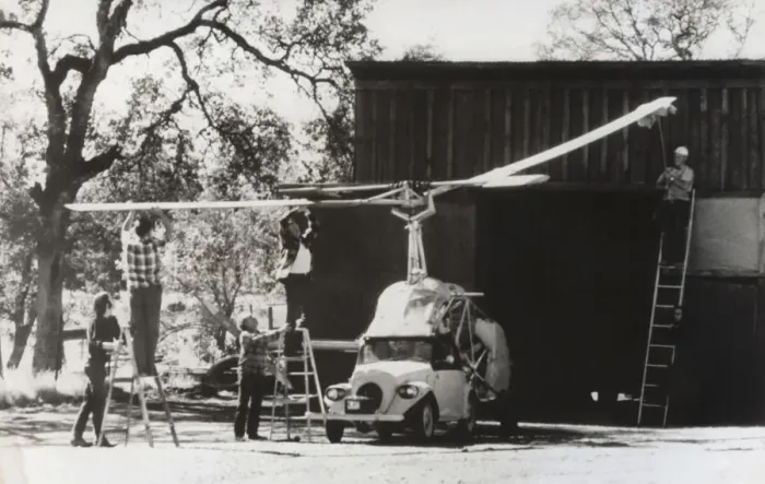 Framed Print : Men Standing on Ladders Attaching the Rotors Onto a Heli? Framed Print : Men Standing on Ladders Attaching the Rotors Onto a Heli?