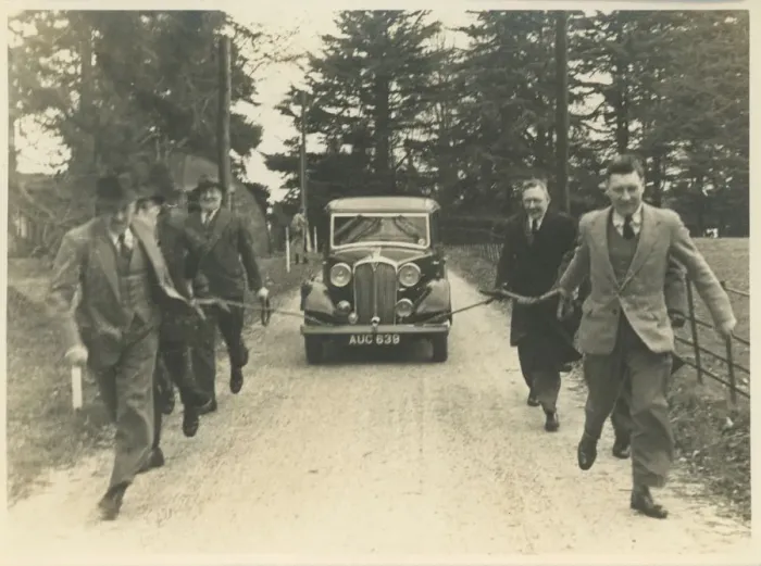 Framed Print : Men Towing Vintage Rover Car Framed Print : Men Towing Vintage Rover Car