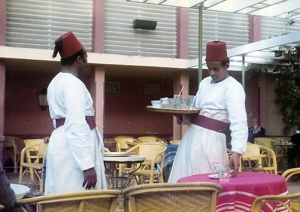 Two men in traditional Egyptian waiter?s dress in a restaura