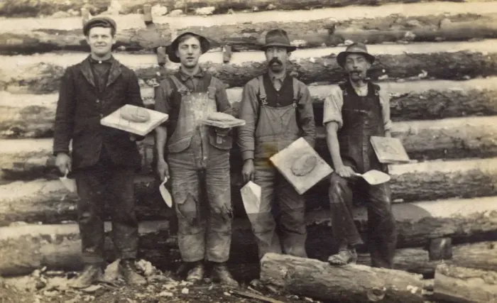 Framed Print : Four men with trowels and cement on boards, USA Framed Print : Four men with trowels and cement on boards, USA
