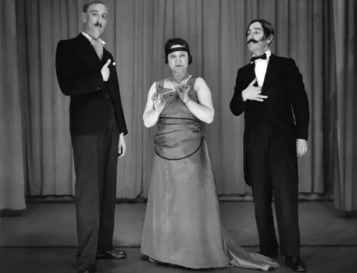 Framed Print : Two men and a woman performing in a comic sketch Framed Print : Two men and a woman performing in a comic sketch