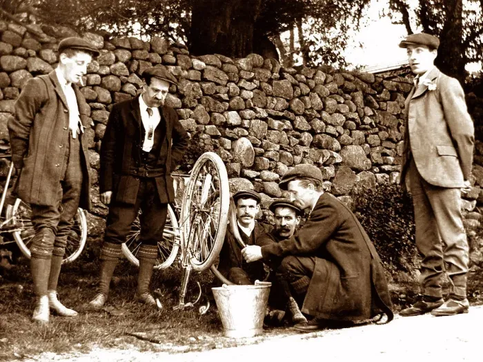 Framed Print : Mending a puncture, early cycling Framed Print : Mending a puncture, early cycling
