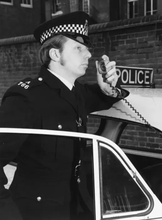 Framed Print : Met Police officer on his car radio Framed Print : Met Police officer on his car radio