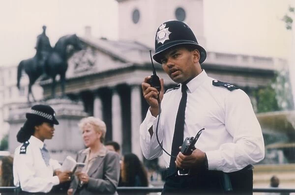 Met Police officer on his radio, London