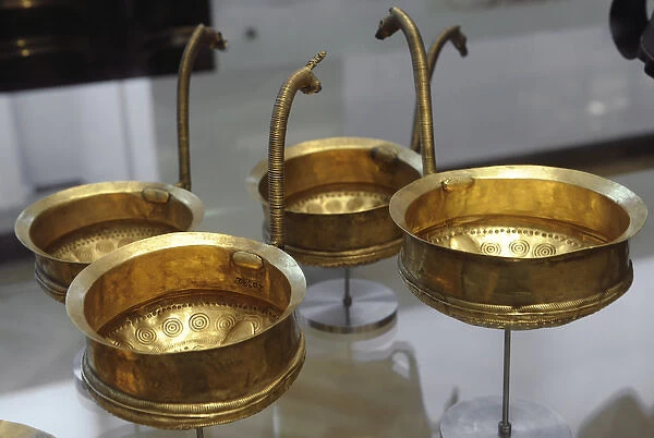 Metal Age. Golden bowls, most with handle shaped like horses