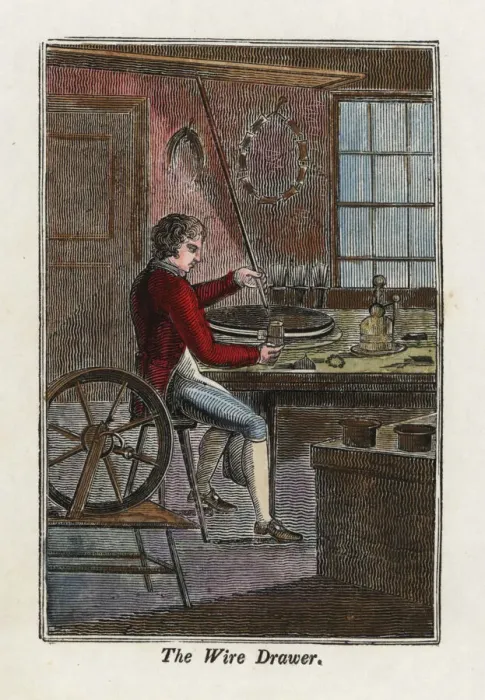 Framed Print : A metal worker using a wire-drawing machine Framed Print : A metal worker using a wire-drawing machine