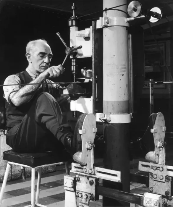 Framed Print : A metalworker operating a drill Framed Print : A metalworker operating a drill