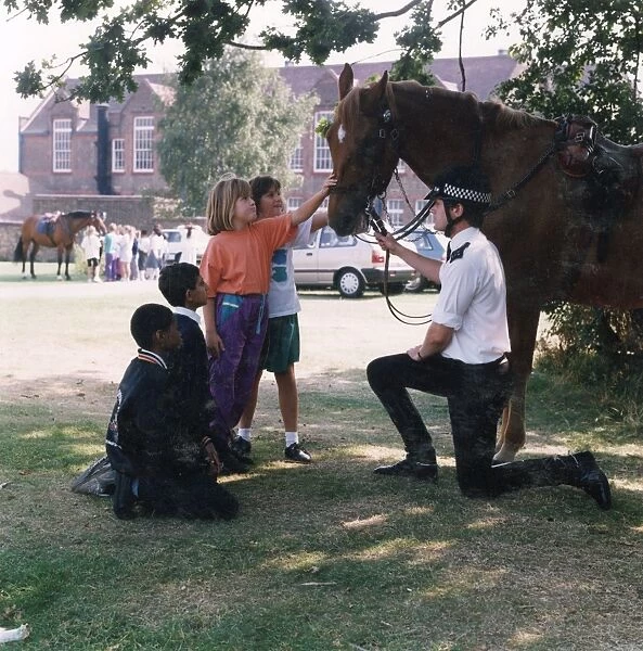 Metropolitan Police officer with horse and children