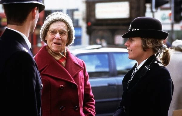 Metropolitan Police officers with a member of the public