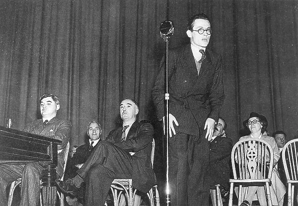 Michael Foot giving a speech, with Nye Bevan on the left