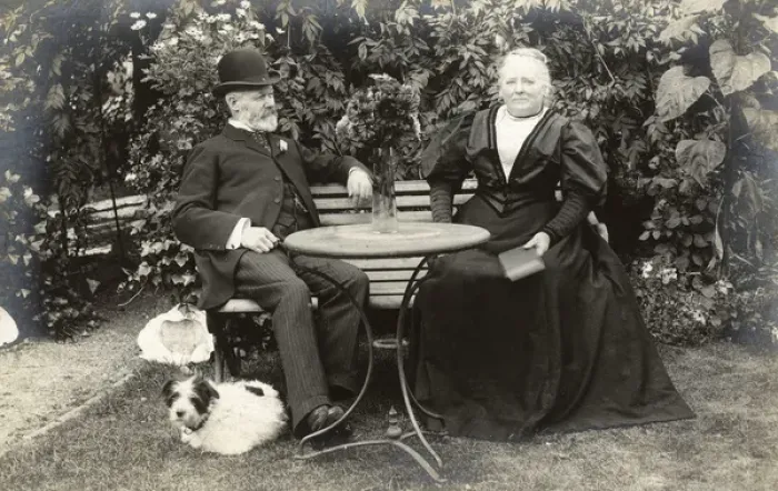 Framed Print : Middle aged couple and a dog in a garden Framed Print : Middle aged couple and a dog in a garden