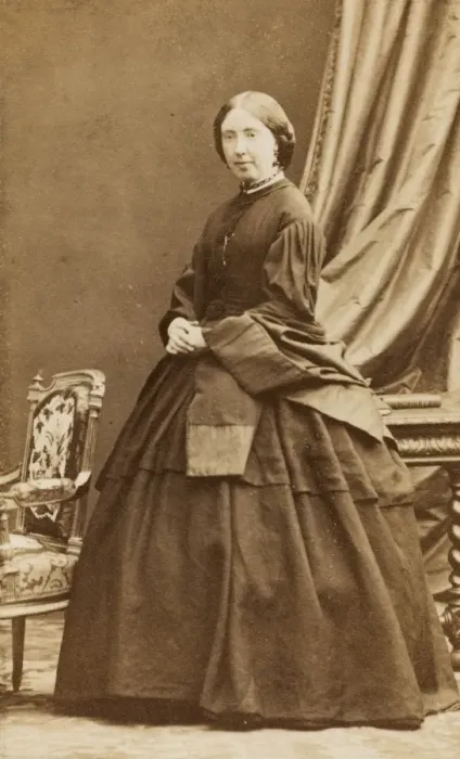 Framed Print : Middle-aged Victorian woman in a dark crinoline dress Framed Print : Middle-aged Victorian woman in a dark crinoline dress