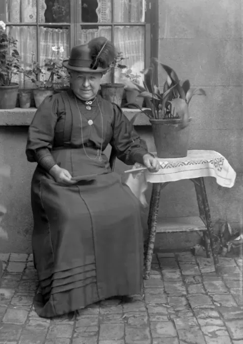Framed Print : Middle-aged woman with potted plants