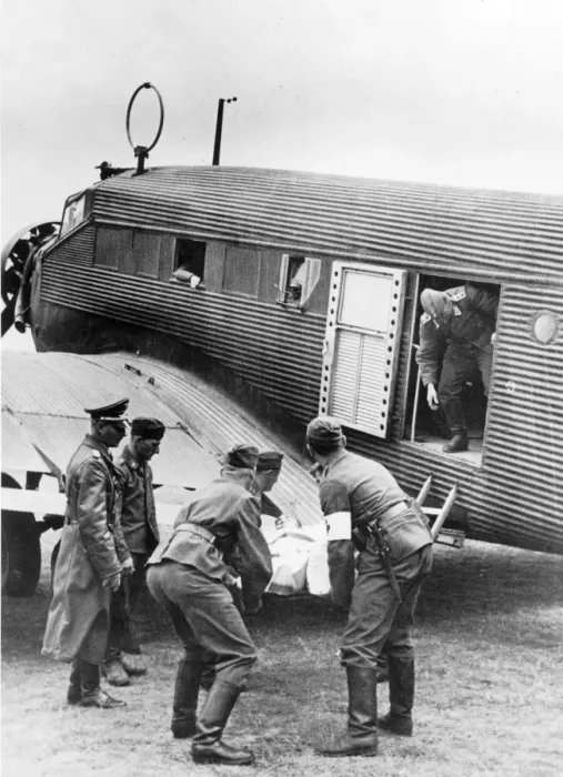 Framed Print : A military Junkers Ju52 / 3m being loaded with a casualty Framed Print : A military Junkers Ju52 / 3m being loaded with a casualty