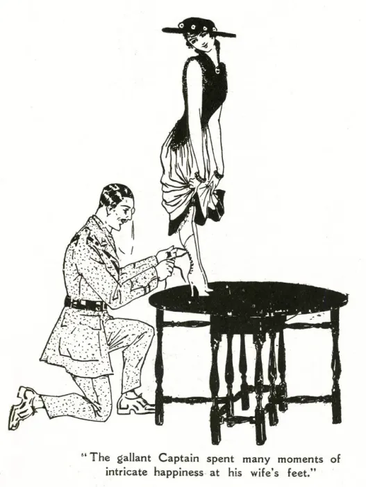 Framed Print : Military man lacing his wifes boots, 1916 Framed Print : Military man lacing his wifes boots, 1916