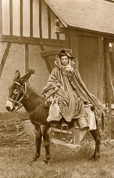 Milkmaid on a donkey, Normandy, Northern France