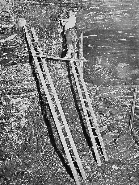 Miner working a high seam Victorian period