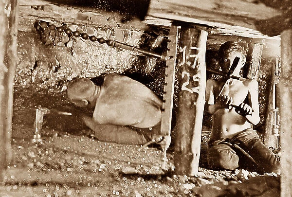 Miners drilling holes in a two foot seam early 1900s