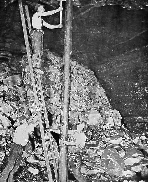 Miners fitting long pit props Victorian period
