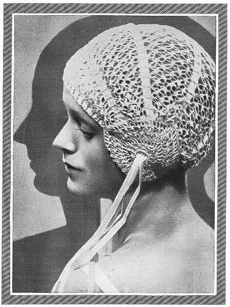 Model wearing close-fitting crocheted bourdoir cap Date: 1929