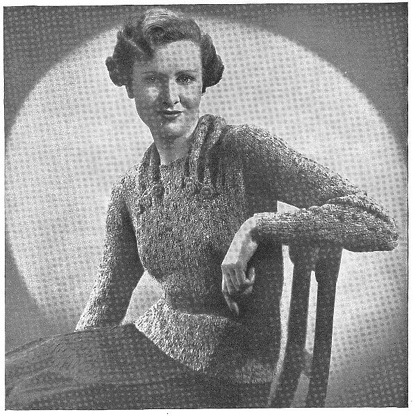 Model wearing a tweedy knitted jumper Date: 1936
