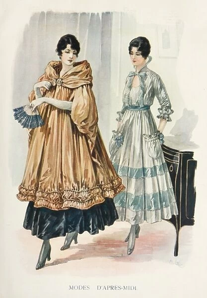 Modes d. Two models dressed in elegant afternoon gowns, one with a sumptuous cloak or coat