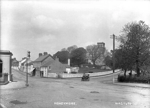 Moneymore - a view of a crossroads with a motor car on the road